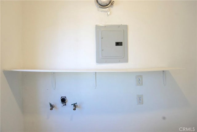 laundry area featuring hookup for a gas dryer and electric panel