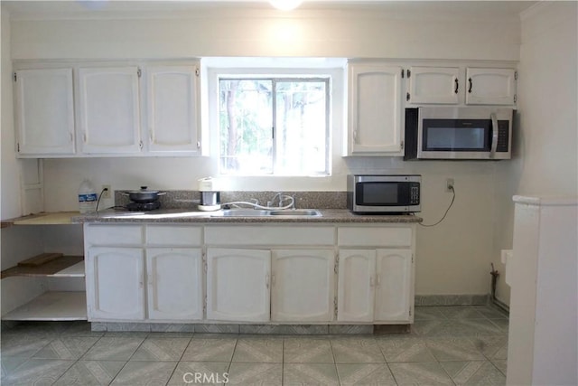 kitchen with sink and white cabinets