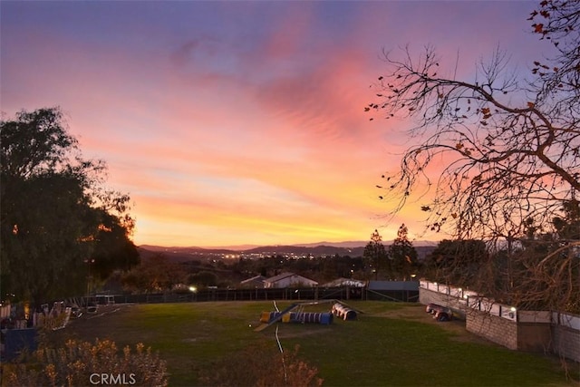 view of yard at dusk