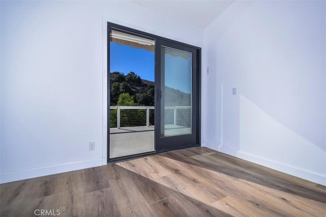 empty room featuring hardwood / wood-style floors