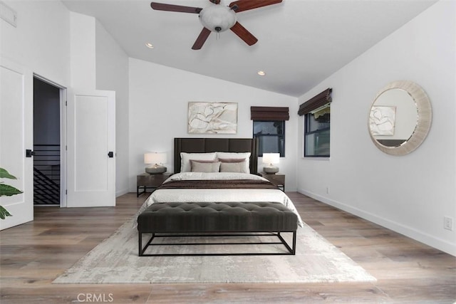 bedroom featuring lofted ceiling, hardwood / wood-style floors, and ceiling fan