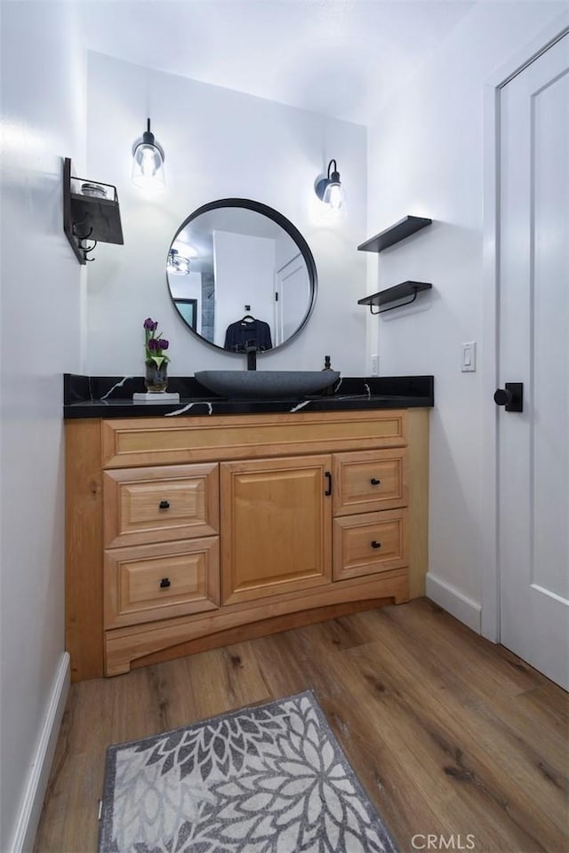 bathroom with wood-type flooring and vanity