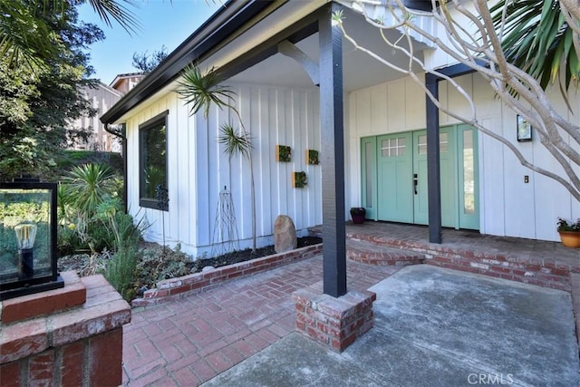 property entrance featuring a patio area