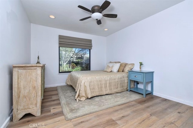 bedroom featuring light hardwood / wood-style floors and ceiling fan