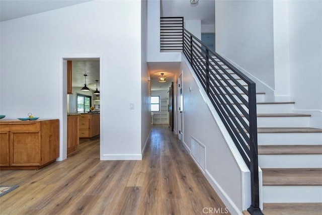 staircase featuring hardwood / wood-style flooring