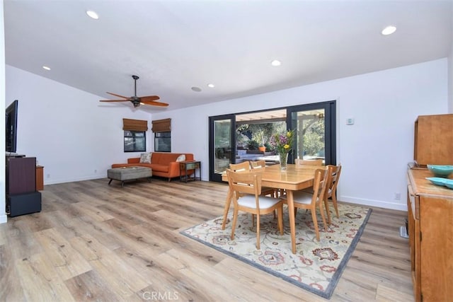 dining area featuring light wood-type flooring and ceiling fan