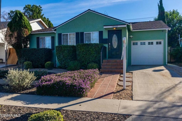 ranch-style house featuring a garage