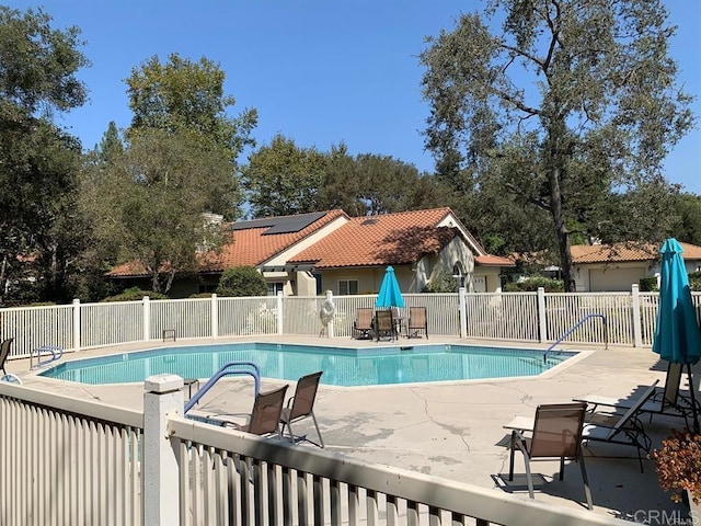 view of pool featuring a patio