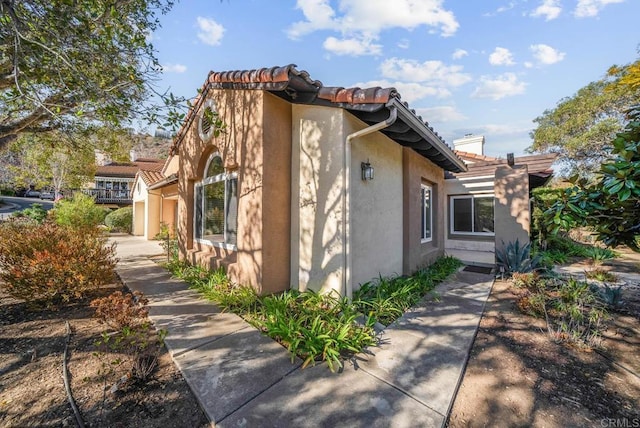 view of property exterior with a garage