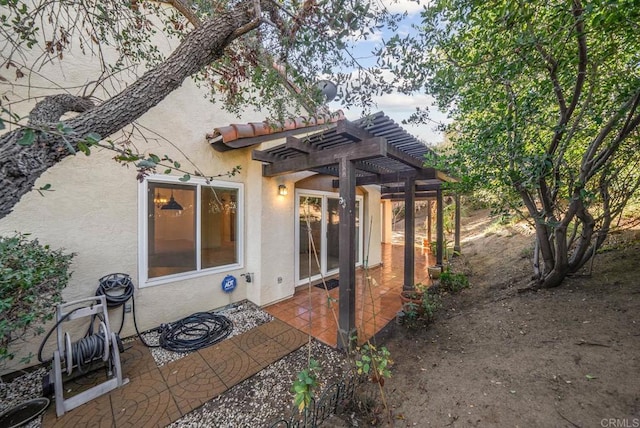 exterior space featuring a patio area and a pergola