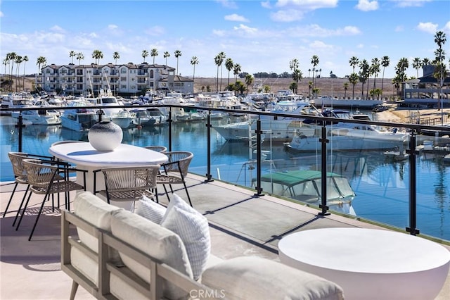 balcony featuring a water view