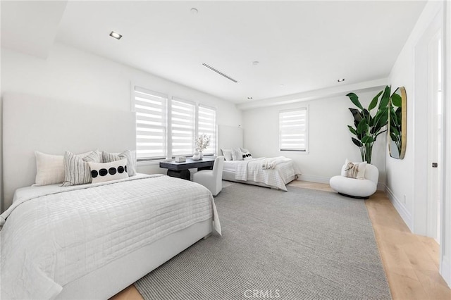 bedroom with light hardwood / wood-style flooring