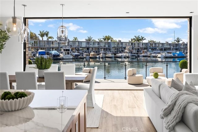 dock area featuring a water view and an outdoor hangout area