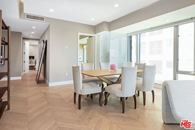 dining area with light parquet floors