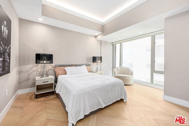 bedroom featuring ornamental molding and parquet flooring