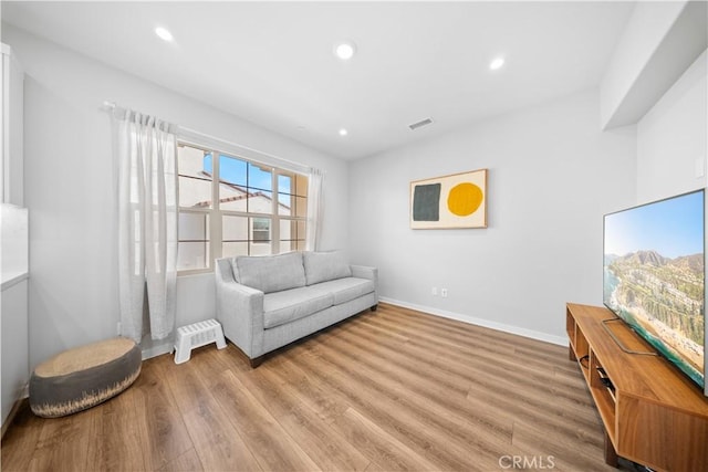 sitting room with light hardwood / wood-style flooring