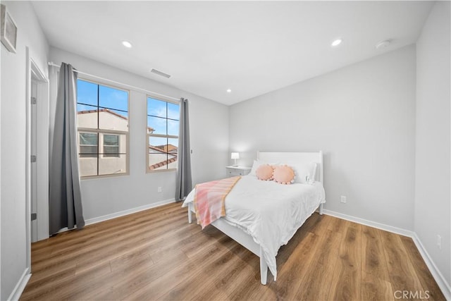 bedroom featuring hardwood / wood-style flooring