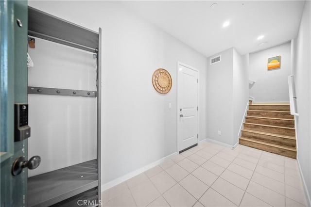 foyer featuring light tile patterned floors