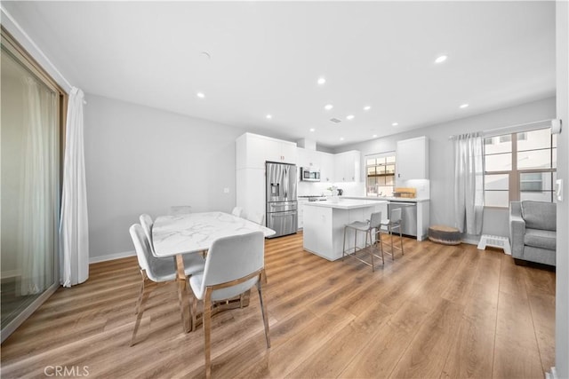 dining room with light hardwood / wood-style floors