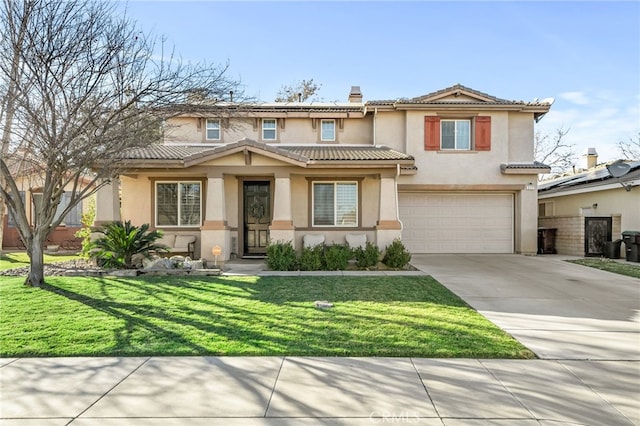 mediterranean / spanish house with a garage and a front lawn