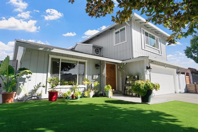 view of front of house with a garage and a front lawn