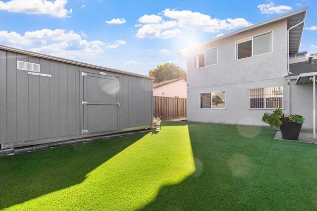 view of yard with a storage unit