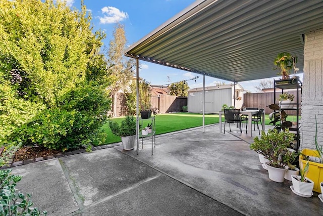 view of patio with a storage shed