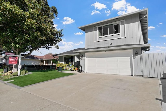 front facade featuring a garage and a front yard