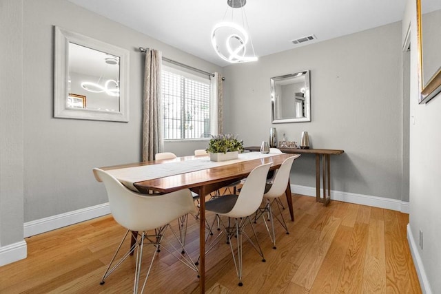 dining space featuring light hardwood / wood-style flooring