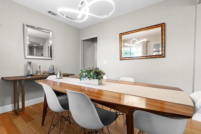 dining room featuring light hardwood / wood-style floors