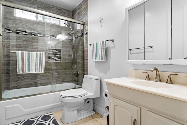 full bathroom featuring vanity, tile patterned floors, shower / bath combination with glass door, and toilet