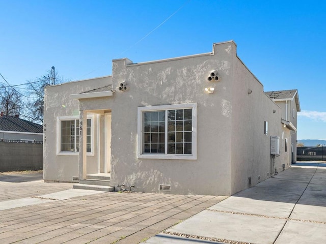 back of house with a patio