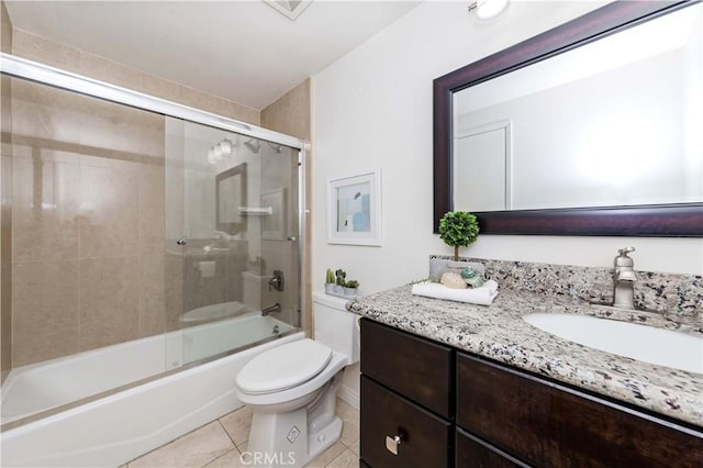 full bathroom with combined bath / shower with glass door, vanity, toilet, and tile patterned flooring