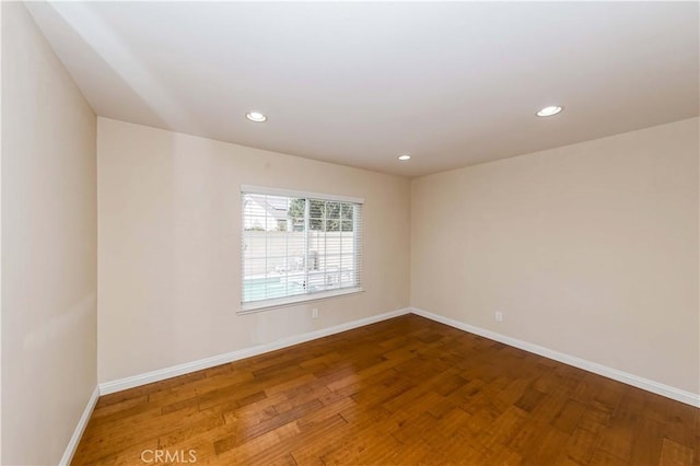 unfurnished room featuring wood-type flooring