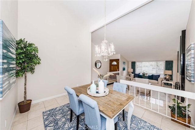 tiled dining room with a chandelier