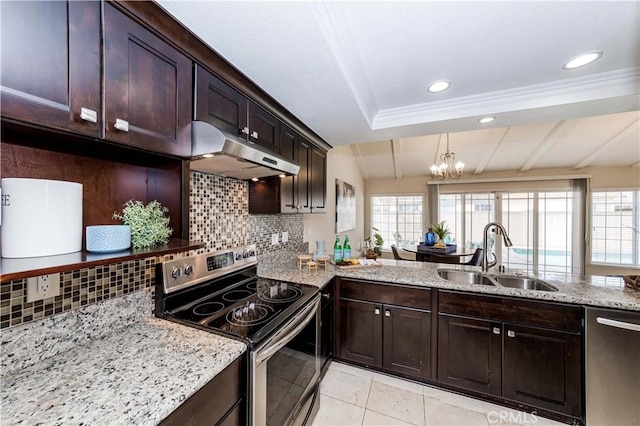 kitchen featuring sink, tasteful backsplash, light stone countertops, and stainless steel appliances