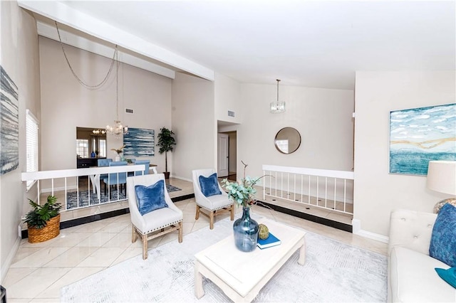 tiled living room featuring a chandelier and high vaulted ceiling