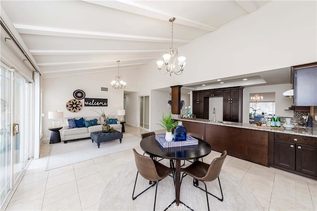 dining area featuring vaulted ceiling with beams, light tile patterned floors, and a notable chandelier