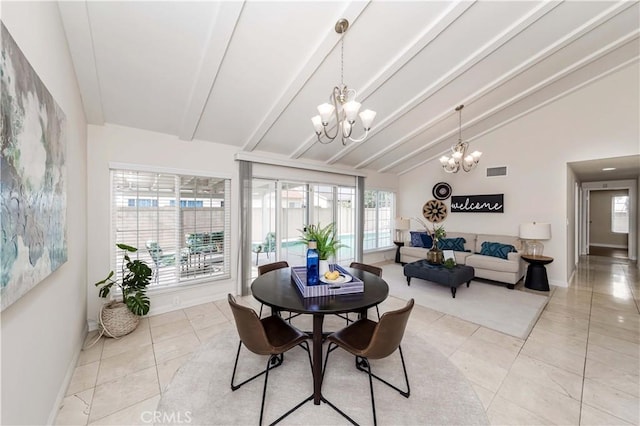 tiled dining space with lofted ceiling with beams and an inviting chandelier