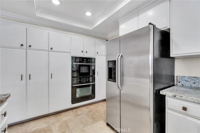 kitchen with white cabinets, black double oven, stainless steel fridge with ice dispenser, a raised ceiling, and crown molding