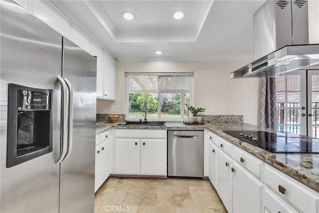 kitchen featuring island exhaust hood, stainless steel appliances, and white cabinets