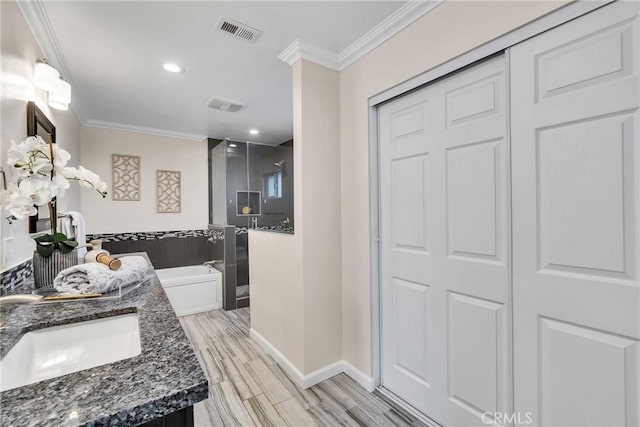 bathroom featuring independent shower and bath, crown molding, wood-type flooring, and vanity