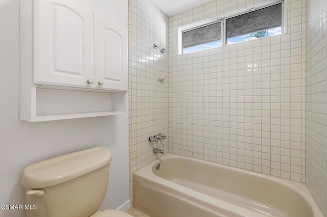 bathroom featuring shower / washtub combination and toilet