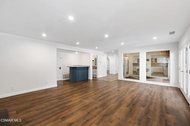 unfurnished living room with dark hardwood / wood-style flooring