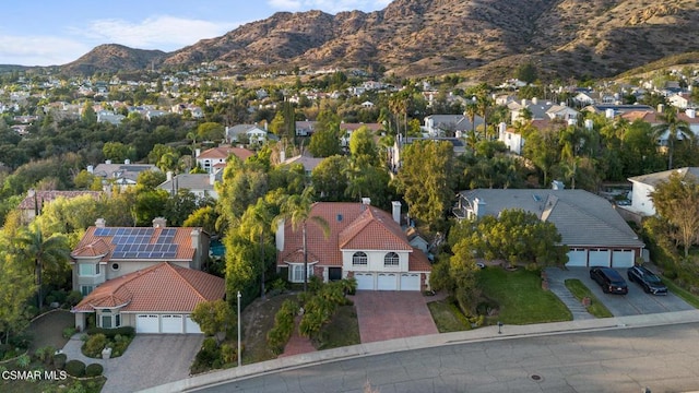 birds eye view of property featuring a mountain view