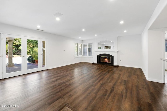 unfurnished living room with dark wood-type flooring