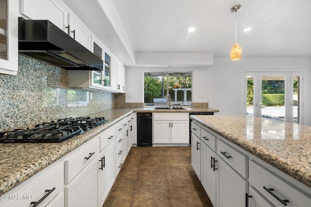 kitchen featuring sink, decorative light fixtures, black gas cooktop, decorative backsplash, and white cabinets