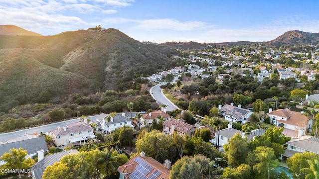 birds eye view of property with a mountain view