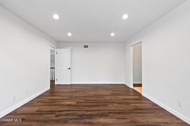 unfurnished room featuring dark hardwood / wood-style flooring