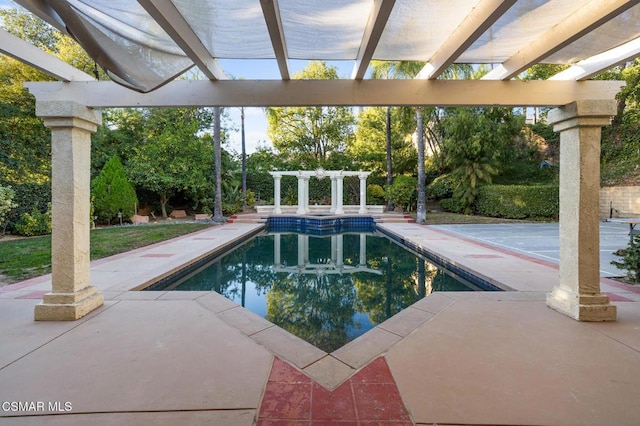 view of swimming pool with a pergola